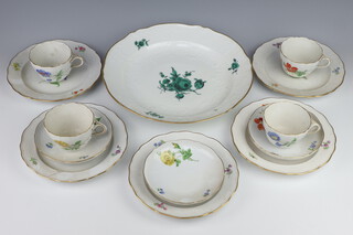 A 19th Century Meissen part tea set comprising 4 tea cups (1 with cancellation mark and 226), 3 saucers (1 with cancellation mark impressed 37 222G over M), 5 small (all with cancellation mark, impressed 4 and painted no. 224 over 122)  and 1 large plate (impressed 3725 14 126) 