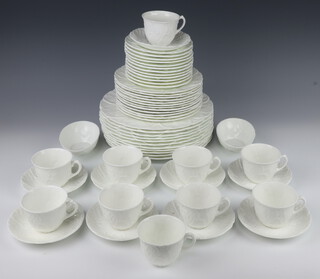 A set of Coalport Country Ware tableware comprising 10 tea cups, 9 saucers, 12 small plates (1 a/f), 12 medium plates, 11 dinner plates (2 a/f), an egg cup (a/f) and 2 asparagus bowls  