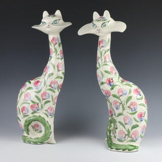 A pair of stylish ceramic cats decorated with flowers, monogrammed J R, 52cm 