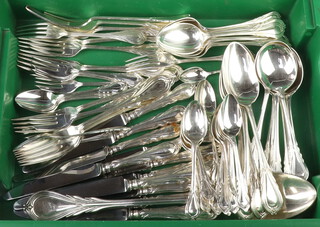 A quantity of silver plated lily pattern cutlery comprising 6 dinner knives, 5 dessert knives, 6 dinner forks, 6 dessert forks, 6 cake forks, 6 tea spoons, 6 coffee spoons, 6 grapefruit spoons, 4 table spoons, 6 soup spoons, basting spoon, 6 dessert spoons and 2 ladles 