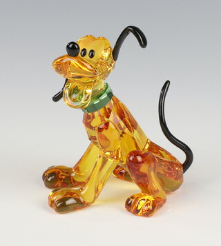 A Swarovski Crystal figure in coloured glass of a seated Pluto 9cm, boxed  