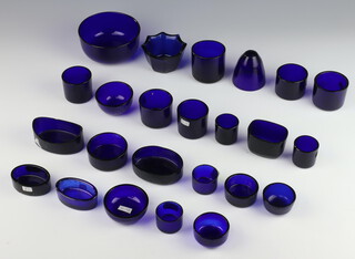 A quantity of blue glass condiment liners