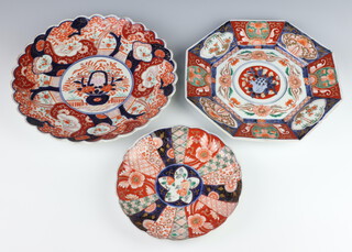 A Japanese Imari octagonal plate with segmented decoration 29cm, a circular ditto with lobed border 30cm and 1 other 21cm  
