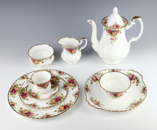 A Royal Albert Old Country Rose pattern 51 piece dinner/tea service comprising 6 coffee cups, 4 saucers (4 cracked), 6 tea cups, 6 saucers (1 cracked), 6 twin handled soup bowls and saucers, milk jug, cream jug, 2 bowls, coffee pot (a/f), 2 bowls (1 a/f), sandwich plate, 5 small plates, 6 dinner plates (all dinner plates are seconds) 
