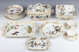 An extensive 160 piece Charles Field Haviland, Limoges dinner, dessert and tea service, stamped CFH CDM,  comprising 10 large tea cups, 7 small cups, 6 large saucers, 8 small plates (2 a/f), 35 dinner plates (3a/f), 22 medium plates (5 a/f), 11 side plates, 18 shallow soup bowls, 7 dessert plates (3 a/f), oval meat plate, jug drainer, 2 side bowls, 6 tazzas (1 a/f), square bowl, 4 small rectangular tureens (1 cracked) and four stands, 2 oval bowls, 10 small rectangular plates, 2 medium plates, 2 large plates, 2 meat plates (1 a/f), one 2 handled plate, 4 medium tureens and 1 large tureen with hand painted and partially printed  decoration of birds on blossoming boughs including parrots, kingfishers, swifts, swallows and chaffinches 