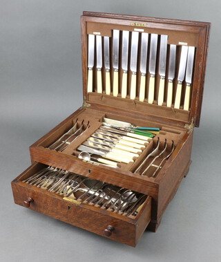 An oak canteen containing a set of silver plated cutlery for 6 