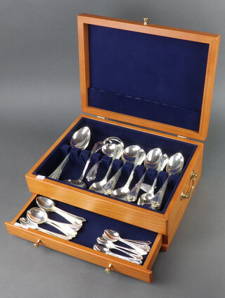 A modern canteen containing a set of silver plated lily pattern cutlery comprising 12 coffee spoons, 12 tea spoons, 12 dessert spoons, 12 soup spoons and 3 table spoons together with 2 ladles 