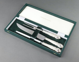 A cased silver plated lily pattern carving set