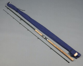 A Bruce Walker multispin 10', 2 piece spinning fishing rod in blue cloth bag 