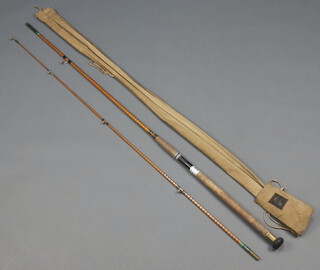 An Alcock Perfect twin section cane salmon fishing rod with original cloth bag 