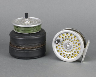 A Hardy Marquis 6 line weight fishing reel complete with spool together with a wet fly spare spool in canvas bag