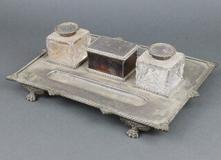 A Victorian silver plated ink stand comprising 2 cut glass ink wells, 2 pen trays and a lidded box, raised on claw feet 35cm 