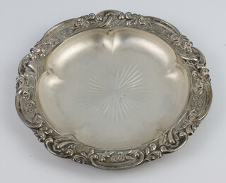 A Victorian circular embossed silver butter dish with glass liner Sheffield 1896 by James Dixon and Sons, 166 grams 