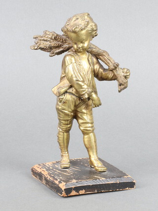 A 19th Century gilt bronze figure of a boy with sheath of corn, raised on a square wooden base 16cm 