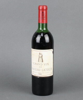 A bottle of 1967 Chateau Latour Grand Vin de Chateau Latour red wine, low on the neck  