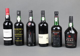 A bottle of 10 Year Old Reserve Madeira, a bottle of Vintage Character port, bottle of Warres 2006 late bottled vintage port, bottle of Cockburn's Special Reserve port, bottle of Vintage Character port and a bottle of Taylors First Estate port  