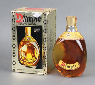 A bottle of Dimple Haig whisky boxed