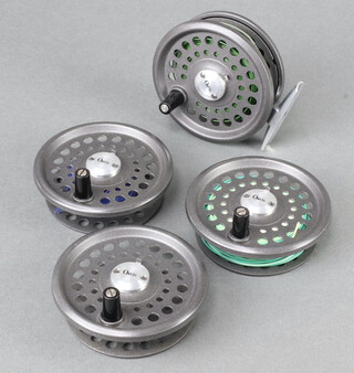 An Orvis Madison trout fly fishing reel with 4 spare spools and lines, in a zipped case 
