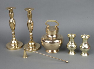 A polished brass circular urn and cover 15cm, a pair of brass candlesticks on circular bases 26cm, pair of Japanese engraved club shaped vases 12cm and a candle snuffer