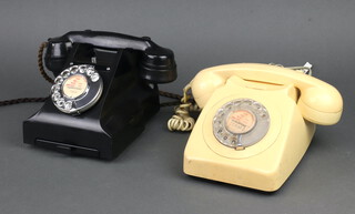 A black Bakelite dial telephone the base marked E2 and FWR 63/2, together with a 1970's yellow dial telephone 
