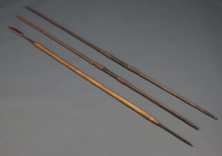 Two Masai spears one 90cm the other 91cm with double bladed points and 1 other spear with a leaf shaped point 90cm 