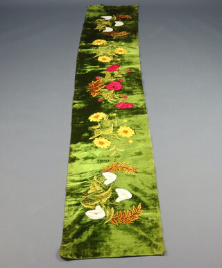 A Victorian green chenille and embroidered table runner decorated flowers 247cm x 43cm 