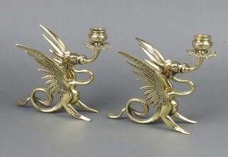 A pair of Victorian brass candlesticks in the form of griffins 17cm h x 20cm x 9cm 
