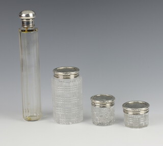 Three Victorian cut glass dressing table jars with silver collars London 1856 (some chips and dents and associated bases) together with a faceted cut glass hairpin bottle with silver collar 
