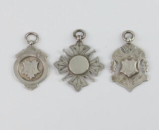 Three silver watch chain medallions, 22 grams