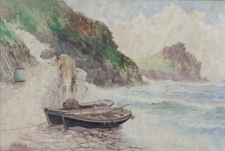 J C Uren, watercolour, beached fishing boats with rocky outcrop 34cm x 52cm, signed to bottom left corner 