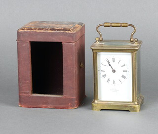 Mappin & Webb, a 19th/20th Century 8 day timepiece with enamelled dial, Roman numerals marked Exao by Mappin & Webb, contained in a gilt metal case, complete with key and red leather travelling case 10cm x 8cm h x 5cm d 