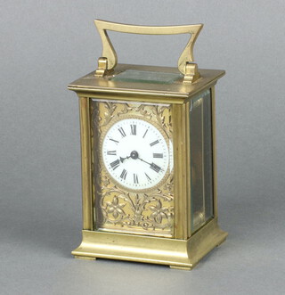 A 19th Century French 8 day carriage timepiece with 4cm circular enamelled dial, Roman numerals, contained in a gilt metal case complete with key 11cm x 8cm x 6cm 