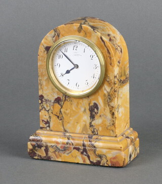 A timepiece contained in an arch shaped orange and purple veined marble case the 5cm dial with Roman numerals marked "A La Renaissance Le Havre", 13cm x 9.5cm x 4cm, no key 