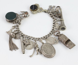 A silver curb link Langtree watch chain, hung 2 seals and 13 various charms - some silver and plate, gross weight 96 grams 