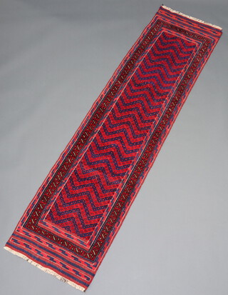 A blue and red ground Meshwani runner with overall geometric design 274cm x 64cm 