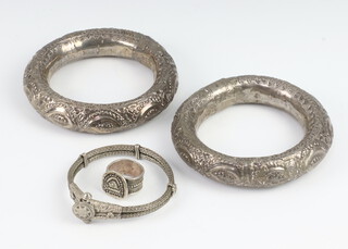 Two white metal sheckle bracelets, a bracelet and a ring  