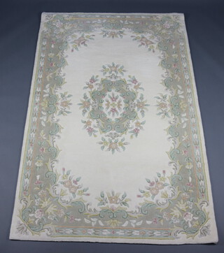 An Indian white and floral ground rug 243cm x 152cm 