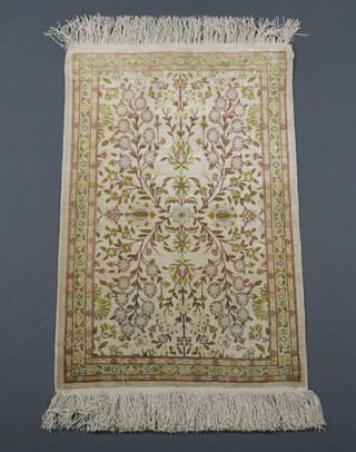 A yellow ground silk Persian rug with deep fringe 82cm x 53cm 