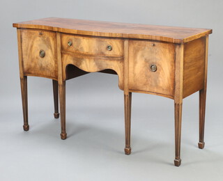 A Georgian style crossbanded mahogany sideboard of serpentine outline, fitted 1 long drawer, secret drawer and pair of cupboards with ring drop handles, raised on square tapered supports, spade feet 92cm h x 152cm w x 52cm d 