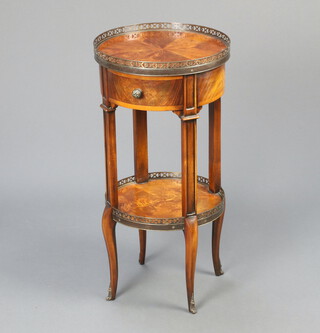 A French 20th Century circular 2 tier walnut occasional table with pierced metal grill fitted a drawer, raised on cabriole supports 72cm h x 36cm diam. 
