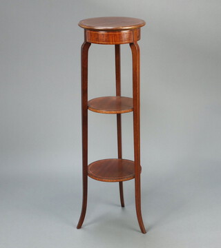 An Edwardian circular inlaid mahogany 3 tier jardiniere stand, raised on outswept supports 107cm h x 33cm diam.  