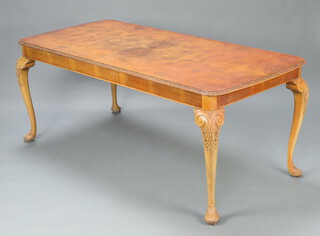 A 1950's Queen Anne style quarter veneered walnut dining table, raised on cabriole supports 73cm h x 182cm w x 84cm d 