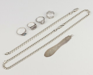 A shaped silver pendant, a 925 curb link bracelet and a 925 chain, 48 grams, together with 4 925 rings  
