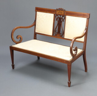 An Edwardian inlaid mahogany double chair back settee with pierced lyre shaped panel to the centre, upholstered seat and back, raised on square tapered supports, spade feet 87cm h x 105cm w x 46cm d (seat 87cm x 35cm)