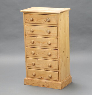 A Victorian style pine pedestal chest fitted six long drawers with tore handles and raised on bracket feet 88cm x 49cm x 30cm (water marks in places)