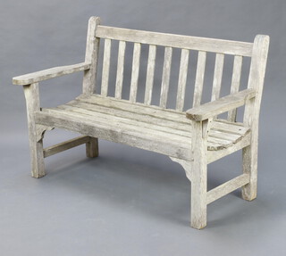 A Lister well weathered hardwood slatted garden bench, 87cm x 127cm x 62cm