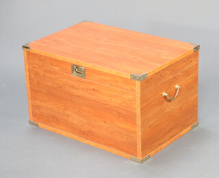 A yew finished coffer/box with hinged lid, brass handles and corner pieces 40cm x 67cm x 44cm
