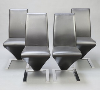 A set of 4 chrome and faux leather Mark Harris contemporary Z shaped dining chairs 96cm x 42cm x 45cm