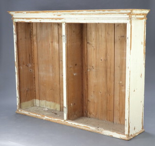 A white painted pine bookcase with moulded cornice 151cm h x 203cm w x 44cm d (no shelves or doors) 