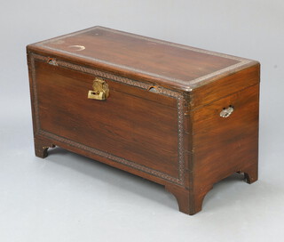 A Hong Kong carved camphor coffer with hinged lid, raised on bracket feet 56cm h x 101cm w x 47cm d 